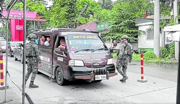 SECURITY CHECK    Soldiers check on vehicles entering Cotabato City from Maguindanao del Sur, following a bombing attempt against a local bus company on Thursday. —FERDINANDH CABRERA/CONTRIBUTOR