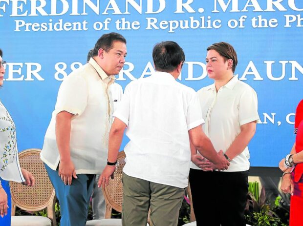 President Marcos (back to the camera),Speaker Martin Romualdez and Vice President Sara Duterte have a short talk at the end of the programinaugurating Pier 88, a “smart port” in Liloan, Cebu province, on Saturday. STORY: Marcos assures post-Lakas Sara Duterte: ‘I’m still your No. 1 fan’