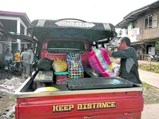 A man in Marogong, Lanao del Sur, loads his family’s belongings into a vehicle on Saturday morning as residents flee their villages because of a threat from local terrorists. STORY: Lanao del Sur families flee as armed group warns of attack