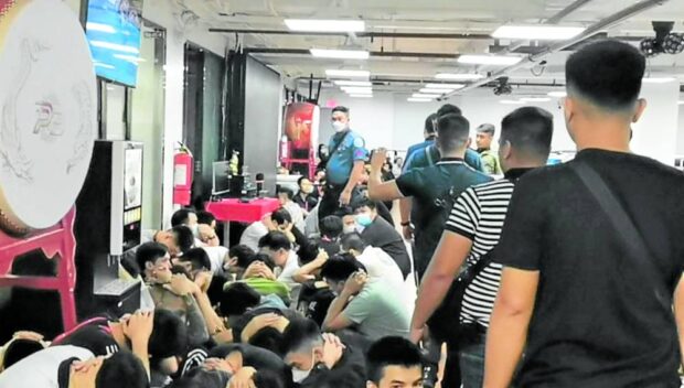 This Philippine National Police handout photo shows the group of foreigners and Filipinos rescued from a human trafficking syndicate in Pampanga early this month. STORY: Senators blame Pagcor, CDC for Pogo abuses, scams in Clark