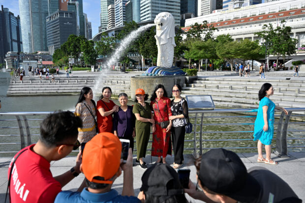 China presses Singapore for visa-free travel deal