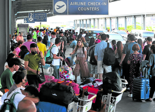 Passengers pile up at the Ninoy Aquino International Airport Terminal 3 as flight delays and cancellations greet them on Monday, the Labor Day holiday, due to a power outage that lasted almost eight hours. —STORY: 8-hour outage hits Naia 3; flights delayed, canceled