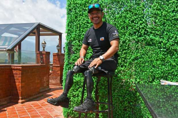 In this file photo taken on April 3, 2023, Gurkha veteran Hari Budha Magar poses during an interview with AFP in Kathmandu. Gurkha veteran Hari Budha Magar scaled Mount Everest on May 19, his public relation team said, becoming the first double above-the-knee amputee to climb the world’s highest peak with 8,849-metre (29,032-foot).