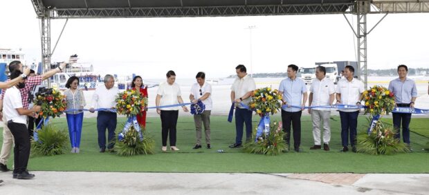 President Ferdinand Marcos Jr. (sixth from right) and Vice President Sara Duterte (seventh from right) lead the grand launching of Pier 88 in Liloan town, north Cebu on Saturday, May 27. President Marcos made a promise that Pier 88 will hasten transit in Visayas. 