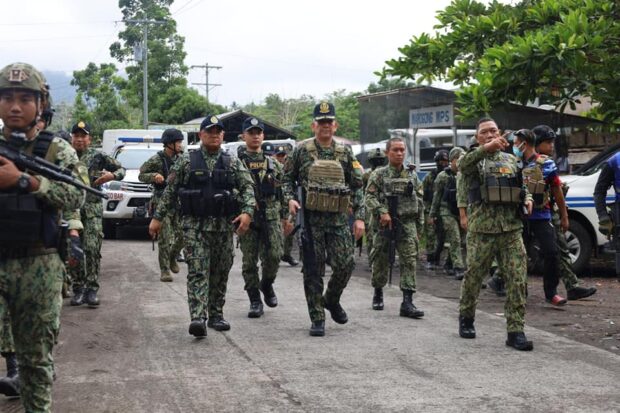 Brig. Gen. Allan Nobleza (third from left), director of the Police Regional Office for the Bangsamoro Autonomous Region in Muslim Mindanao, sets foot in Marogong, Lanao del Sur, and meets with police and military officials to ensure civilians are safe from terror attacks. STORY: Cops, soldiers secure Lanao del Sur town amid threats