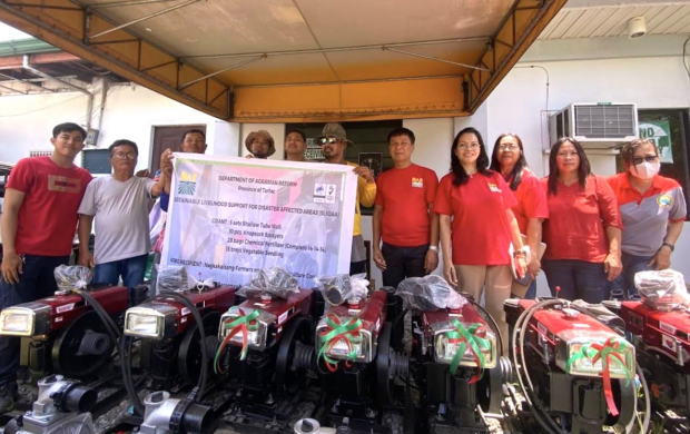 The Department of Agrarian Reform (DAR) in Tarlac turns over farm machinery and equipment to seven reform beneficiary organizations. 