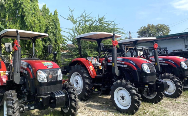 The Department of Agrarian Reform (DAR) in Tarlac turns over farm machinery and equipment to seven reform beneficiary organizations. 