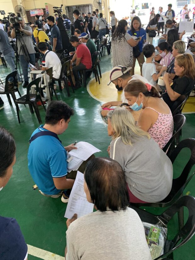 People sit in a queue to avail of the different government aids/services such as 4Ps, in an event organized by the DSWD last Wednesday, May 10, 2023. 