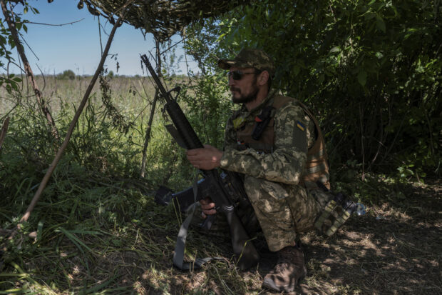 A Ukrainian serviceman looks on near the Ukraine-Russia border, amid Russia's attack on Ukraine, in Kharkiv region, Ukraine, June 4, 2023. REUTERS/Viacheslav Ratynskyi