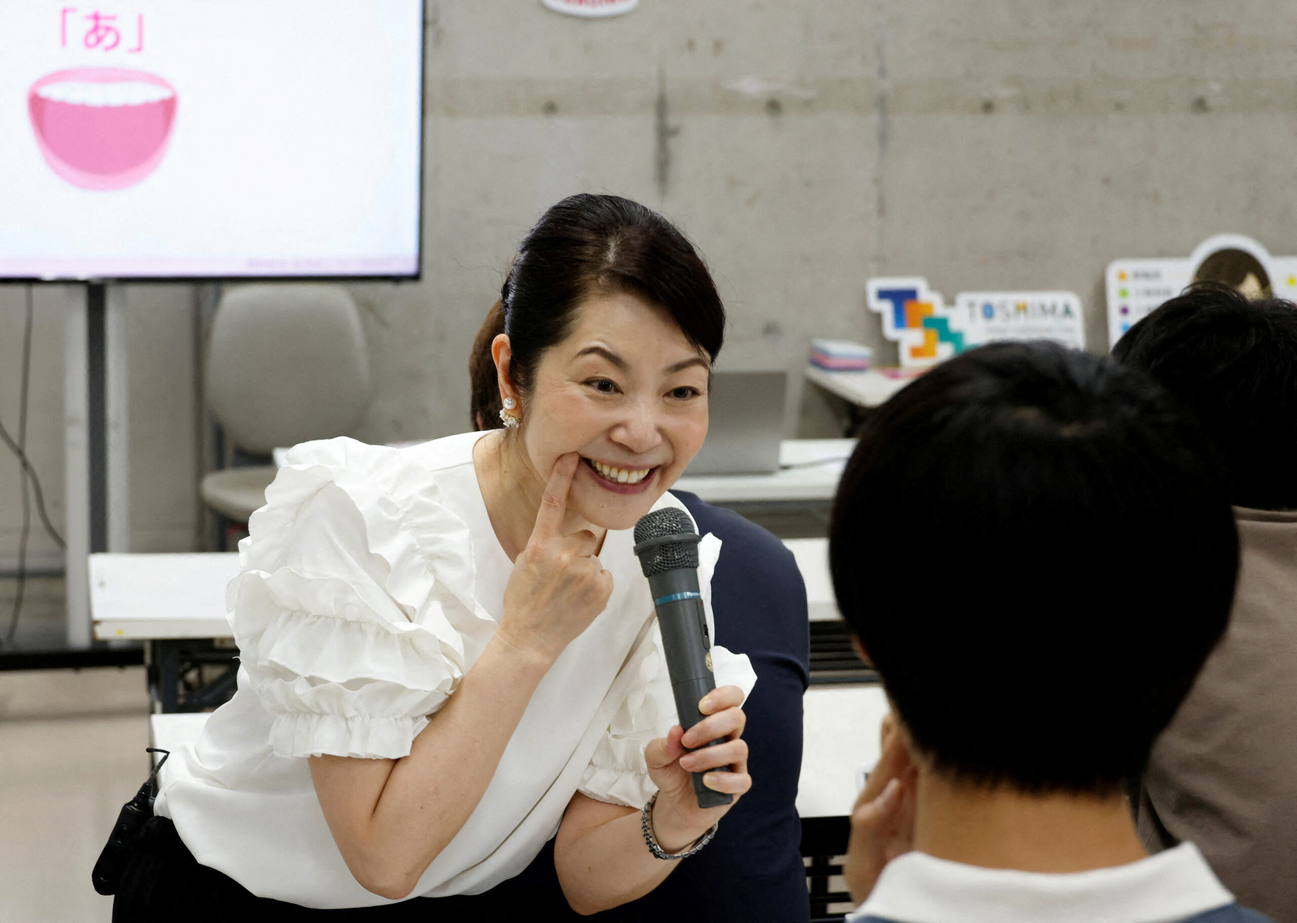 Japanese get trained to smile as masks slowly come off | Inquirer News