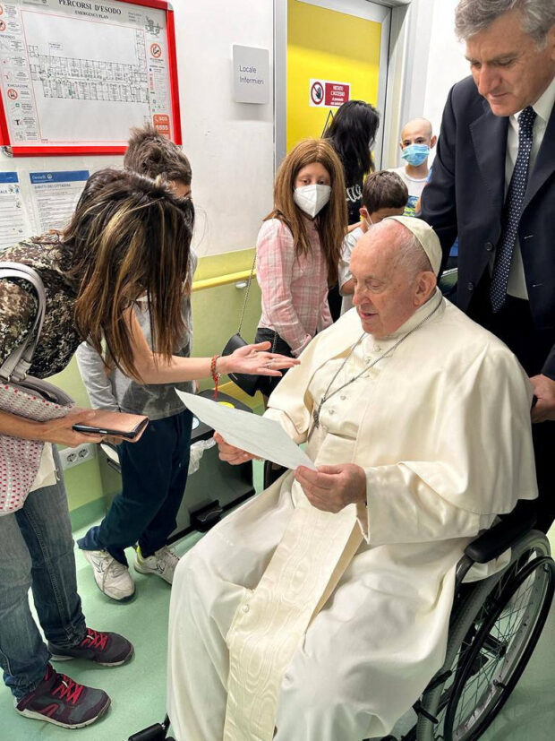 Pope Francis speaks to a person as he visits the children at the paediatric oncology department of Gemelli hospital, in Rome, Italy June 15, 2023. Vatican Media/?Handout via REUTERS