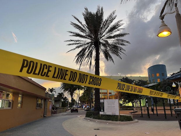 Police cordon at a shooting site in Florida STORY: Bravado, access to guns contribute to mass shootings by teens in US