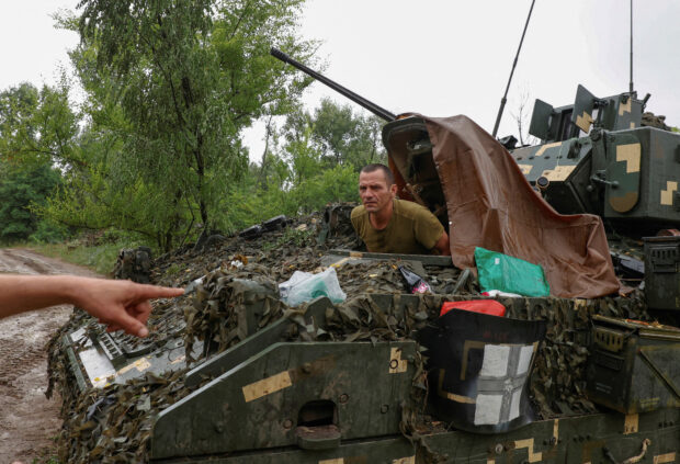 A Ukrainian serviceman of the 47th Magura Separate Mechanised Brigade sits inside a M2 Bradley infantry fighting vehicle at a position near a front line, amid Russia's attack on Ukraine, in Zaporizhzhia region, Ukraine June 26, 2023. REUTERS/Rfe/Rl/Serhii Nuzhnenko/File Photo