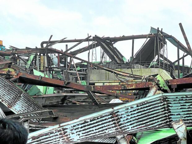 SCARY BUT NOT TOO BAD A regional police photo shows how Typhoon “Betty” twisted the steel framing of an old warehouse at Port Irene in Sta. Ana, Cagayan. —PHOTO COURTESY OF CAGAYAN POLICE   