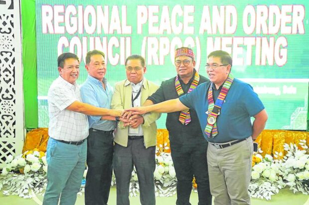 Governors Jim Salliman of Basilan, Abdusakur Tan of Sulu, Yshmael Sali of Tawi-Tawi and Abdulraof Macacua of Maguindanao del Norte join Bangsamoro Chief Minister Ahod Ebrahim for a unity photo after the Regional Peace and Order Council meeting in Maimbung, Sulu, on June 10. STORY: BARMM governors renew calls to defer barangay, SK polls