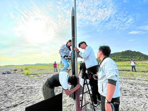 Alumni of St. Cecilia’s College in Cebu prepare to launch the TALA in Capas, Tarlac. STORY: Cebu students launch hybrid rocket, hope more kids reach for stars
