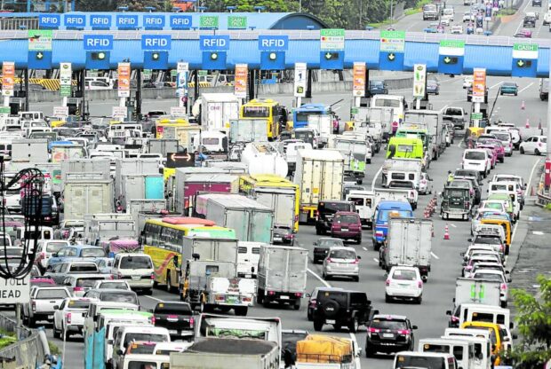 Around 100 truckers from Central Luzon on Friday morning barricaded a portion of Anda Circle leading to Bonifacio Drive in Manila—an area close to the port—in a lightning rally protesting the increased toll rates on the North Luzon Expressway (NLEx).