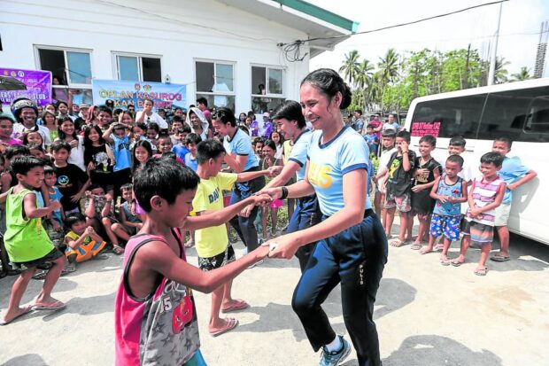 Personnel from the Bicol Police Regional Office dance with children during their visit to an evacuation center in Barangay Mauraro, Guinobatan, Albay, on June 14. The activity is part of the police’s psychosocial intervention program for children displaced by Mayon Volcano’s unrest. STORY: Mayon’s danger zone eyed as national park