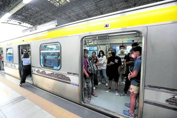 PHOTO: Commuters ride the LRT Line 2 at Recto Station in Manila on January 26, 2023. STORY: Day of Valor: LRTA offers free rides on April 9 