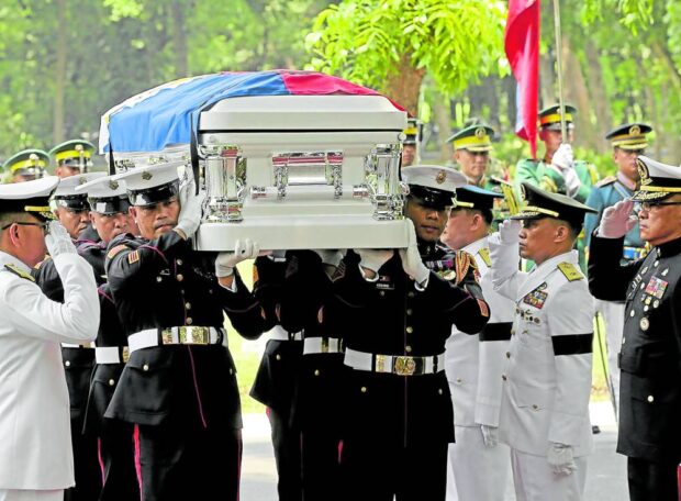 Pallbearers carry the casket of former senator and military chief Rodolfo Biazon to his final resting place at Libingan ng mga Bayani in Taguig City. STORY: Biazon laid to rest with full military honors