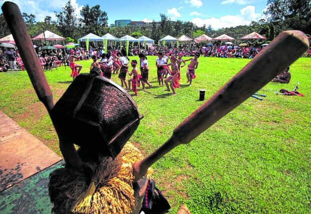 EXPOSURE Young Cordillerans join their elders in a community festivity held at Burnham Park in Baguio City in this 2015 photo. The region’s elders ensure that their children will be exposed tolocal traditions and practices to prepare them as future custodians of Cordillera culture and heritage. —RICHARD BALONGLONG