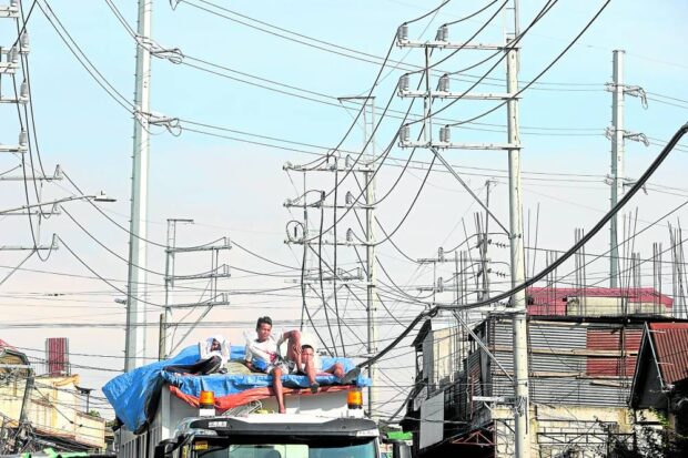 STABLE SUPPLY Regular maintenance of power lines assures households and businesses on Litex Road in Quezon City of stable electricity supply. The Supreme Court, in a decision on a 24-year-old case, says consumers of Manila Electric Co. must be given at least 48 hours before any power disconnection. —NIÑO JESUS ORBETA  meralco cut notice