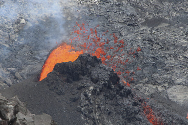 In this photo provided by the U.S. Geological Survey, is an eruption taking place on the summit of the Kilauea volcano in Hawaii, on Friday, June 16, 2023. The eruption that began nearly two weeks ago has come to a pause, scientists said. Kilauea, one of the most active volcanoes in the world, began erupting on June 7 after a three-month pause, displaying fountains of glowing red lava without threatening any communities or structures. (U.S. Geological Survey via AP)