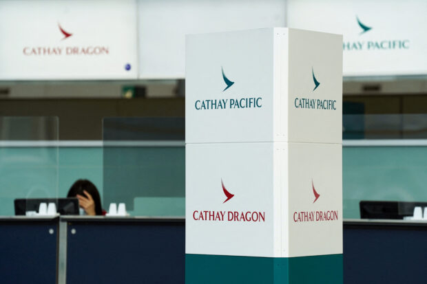 Eleven people were injured on Cathay Pacific's flight CX880 at Hong Kong's international airport early on Saturday after the carrier aborted takeoff due to a technical issue, Cathay said in a statement.