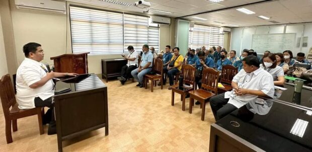 Dr. Romelito Flores (seated left), Cotabato schools division superintendent, gathers the Pikit school heads to assess the level of risk in their places of assignment following the murder of a tacher in Barangay Manaulanan, Pikit last week. (DepEd Cotabato province photo)