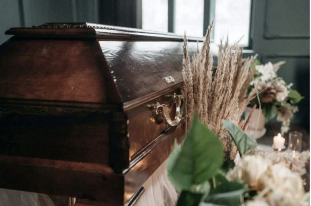 Photo of a coffin for story: Ecuadoran woman wakes up inside coffin at her own wake