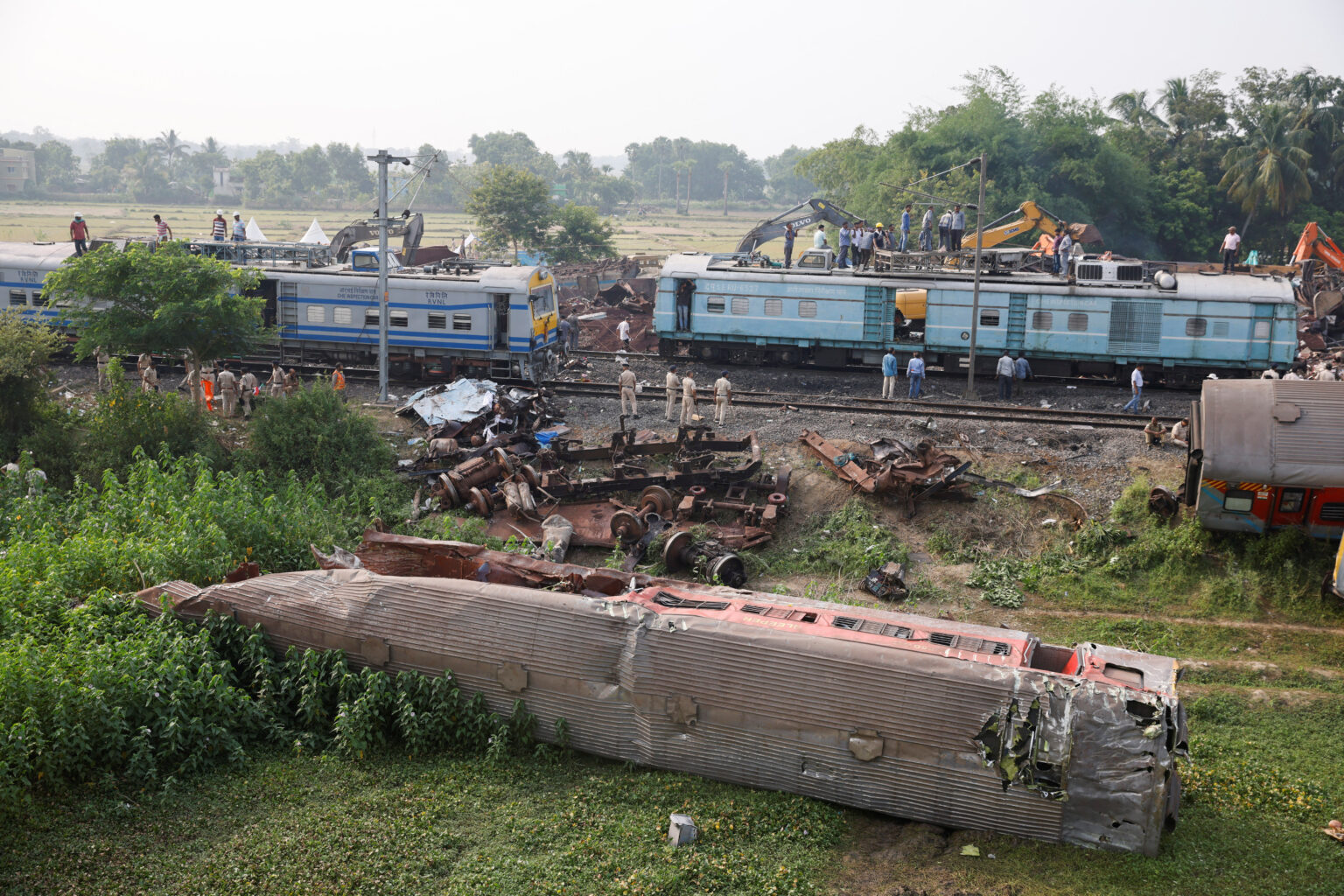 Families, rescuers search for victims of India's worst train crash in