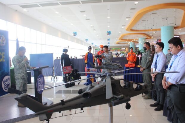 Philippine Air Force personnel, SM representatives, and other visitors join the opening ceremony of PAF Mall Exhibit at SM City Legazpi City on June 1, 2023. 