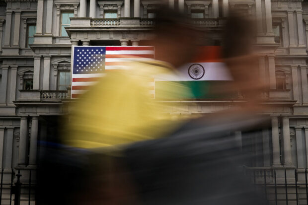 The flags of the United States and India on the Eisenhower Executive Office Building at the White House in Washington
