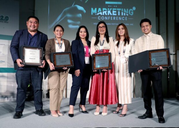 Right Most, Brian Poe Llamanzares stands along side other Filipino Awardees at the Marketing 2.0 conference