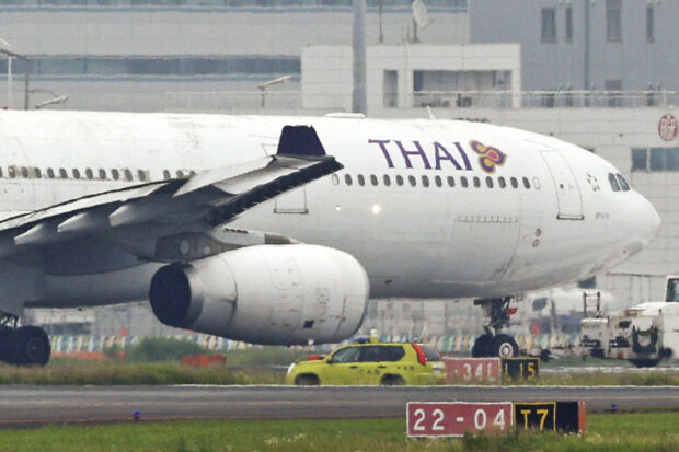 A Thai Airways airplane is seen after making contact with Eva Air airplane at Haneda Airport, in Tokyo, Japan, June 10, 2023. 