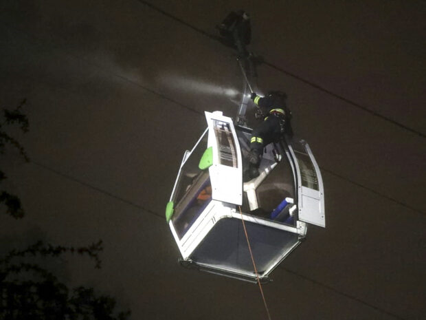 Dozens of people were rescued after being trapped for nearly 10 hours on one of the world's highest tourist cable cars in Ecuador's capital Quito.
