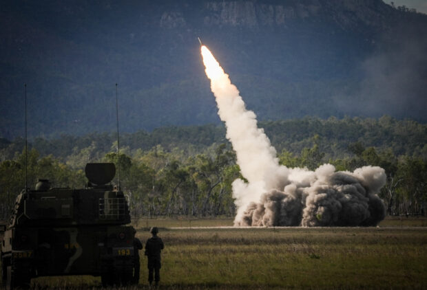 A missile is launched from a United States military HIMARS system during joint military drills at a firing range in northern Australia as part of Exercise Talisman Sabre, the largest combined training activity between the Australian Defence Force and the United States military, in Shoalwater Bay on July 22, 2023. (Photo by ANDREW LEESON / AFP)
