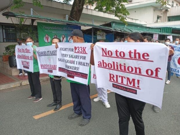 Health workers from the Research Institute for Tropical Medicine (RITM) staged a protest on Tuesday urging the current administration to increase medical employees’ salaries and opposing the government’s plan to abolish their hospital in the guise of forming the Philippine Center for Disease Prevention and Control (CDC). 