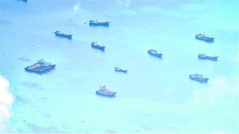 WHERE’S THE FISH? A cluster of Chinese vessels is seen at Del Pilar (Iroquois) Reef on June 30. Pilots who took this photo noted that while they appeared to be fishing boats, they just lingered in the area and hardly engaged in any fishing activity. —AFP WESCOM PHOTO