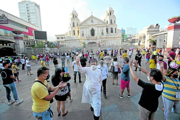 PROMINENT CHURCH The Catholic faithful gather in front of Quiapo Church, home to the widely revered Black Nazarene. —file photo