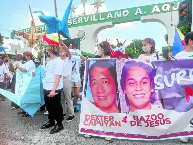 TIRELESS SEARCH The families and supporters of Dexter Capuyan and Bazoo de Jesus stage a protest action outside the headquarters of the Army’s Northern Luzon Command in Tarlac City on June 8, marking the 40th day since the two activists went missing. —PHOTO COURTESY OF SURFACE DEXTER AND BAZOO MOVEMENT