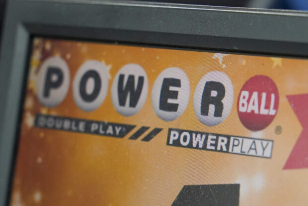  A display panel advertises tickets for a Powerball drawing at a convenience store, Nov. 7, 2022, in Renfrew, Pa. Another Powerball drawing ended with no winner Saturday night, July 15, 2023, sending the jackpot soaring to an estimated $900 million. (AP Photo/Keith Srakocic, File)