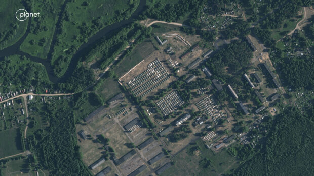 This satellite image provided by Planet Labs PBC and taken on Friday, June 30, 2023, shows apparent recent construction of tents at a former military base outside the Belarusian town of Osipovichi, suggesting it may be used to house fighters from the Wagner mercenary group.