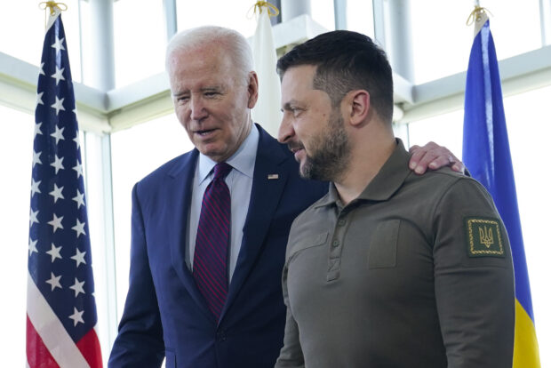 FILE - President Joe Biden, left, walks with Ukrainian President Volodymyr Zelenskyy ahead of a working session on Ukraine during the G7 Summit in Hiroshima, Japan, Sunday, May 21, 2023. Biden will spend four days in three nations next week as he travels through Europe tending to alliances that have been tested by Russia's invasion of Ukraine. Biden wants the trip to serve as a showcase for solidarity as Ukraine struggles to repel Russia from its territory with the help of Western weapons. (AP Photo/Susan Walsh, Pool, File)