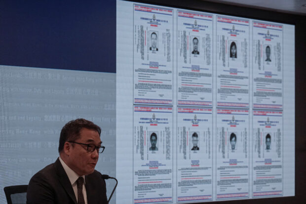 Chief Superintendent of Police (National Security) Li Kwai-wah speaks during a press conference to issue arrest warrants for eight activists