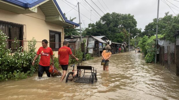 Floodwaters submerged roads and houses in several areas in this province and nearby Olongapo City due to incessant rains brought by the southwest monsoon which is now being strenghtened by severe tropical storm "Falcon" (international name: Khanun).
