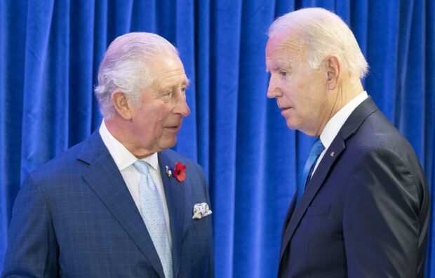 FILE - Britain's Prince Charles, left, greets the President of the United States Joe Biden ahead of their bilateral meeting during the Cop26 summit at the Scottish Event Campus (SEC) in Glasgow, Scotland, Nov. 2, 2021. Biden will spend four days in three nations next week as he travels through Europe tending to alliances that have been tested by Russia's invasion of Ukraine. His first stop is London, where he'll meet with King Charles III and Prime Minister Rishi Sunak. (Jane Barlow/Pool Photo via AP, File)