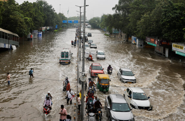 New Delhi races to open jammed flood gates