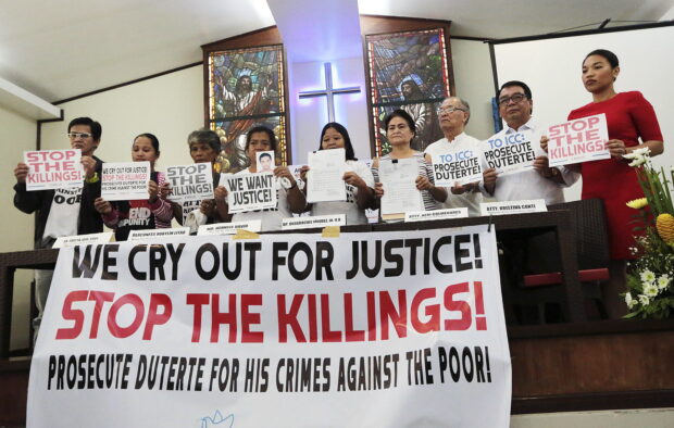 CRY FOR JUSTICE In this 2018 photo, leaders and supporters of Rise Up for Life and for Rights, a network of Church workers, human rights advocates and relatives of victims of drug-related killings, air their appeal for justice for victims of then President Rodrigo Duterte’s bloody war on drugs. —GRIG C. MONTEGRANDE
