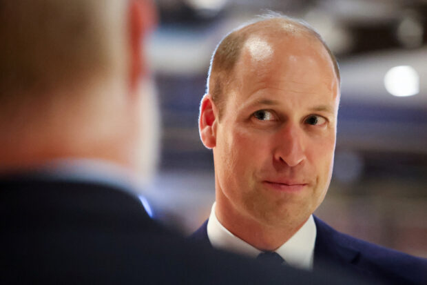 Prince William serves up food to surprised diners
